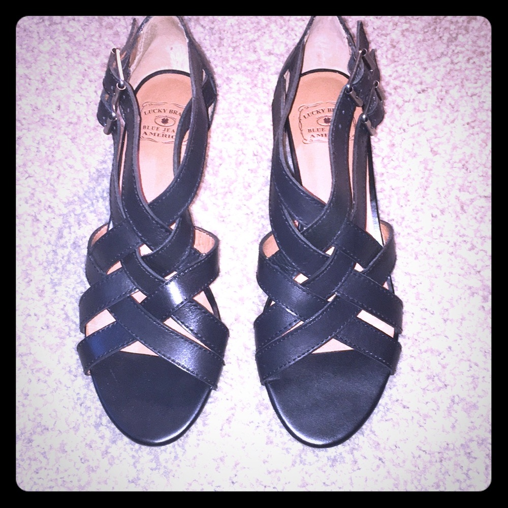 Black size 9 medium  sandal like strapped wedge.